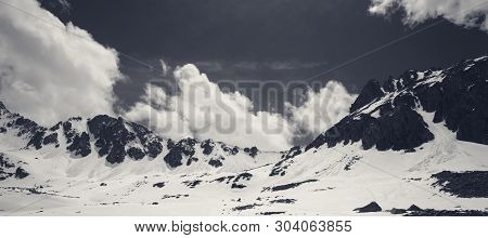 Panoramic View On Snowy Sunlit Plateau With Stones And Cloudy Sky At Spring. Turkey, Kachkar Mountai
