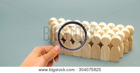 The Crowd Of Wooden Figures Of People. Concept Of Business Team. Labor Collective. Teamwork. Employe