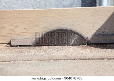 Circular Saw Cutting The Wood. Close-up. Joiners (carpenters) Workshop.
