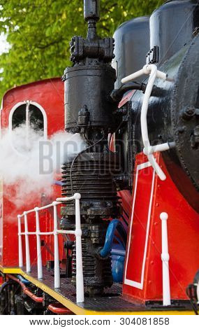 Old Steam Locomotive Blowing Off The Steam Out Of The Whistle.