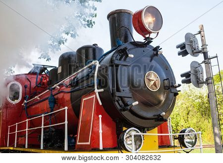 Old Soviet Steam Locomotive Blowing Off The Steam Out Of The Whistle