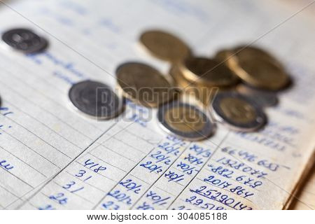 Hand-written Calculations And Coins. Bookkeeping (accounting). Economy. Financial Themes. Money Savi