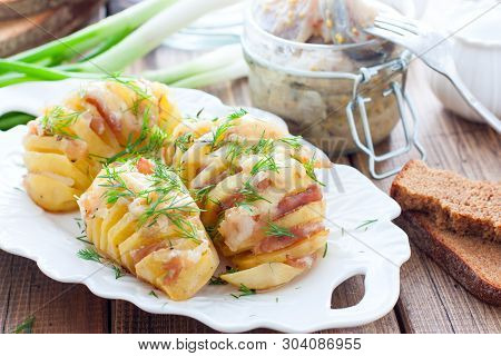 Homemade Oven Roasted Baked Potetoes With Cheese, Bacon, Spices And Herbs , Selective Focus