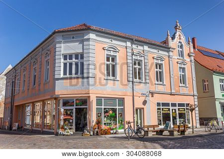 Grimmen, Germany - April 17, 2019: Colorful Shop At The Central Market Square Of Grimmen, Germany
