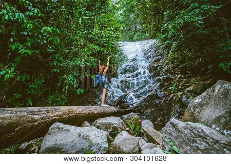 Women Travel. Woman Asia Travelers Travel Nature Forests, Mountains, Waterfalls. Travel Siliphum Wat