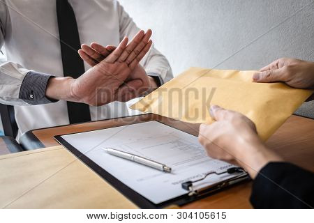 Anti Bribery And Corruption Concept, Business Man Refusing And Don't Receive Money Banknote In Envel