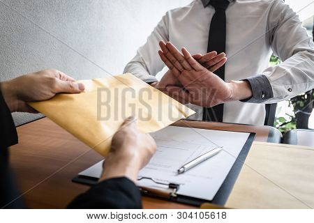 Anti Bribery And Corruption Concept, Business Man Refusing And Don't Receive Money Banknote In Envel