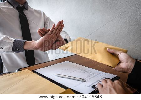 Anti Bribery And Corruption Concept, Business Man Refusing And Don't Receive Money Banknote In Envel