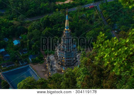 Buddha Statue On Mountain Sunrise Light In Morning