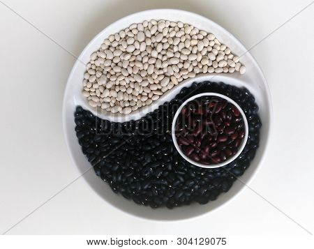 Yin Yang Of Black White Brown Beans On A Round Platter