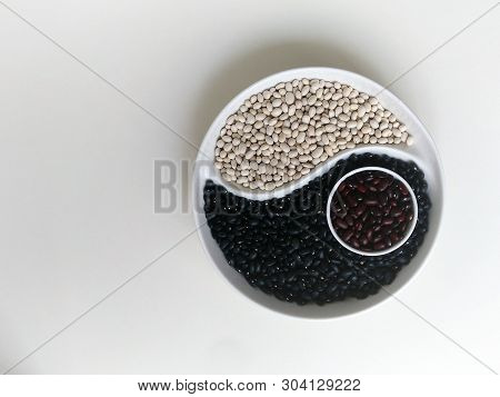 Yin Yang Of Black White Brown Beans On A Round Platter