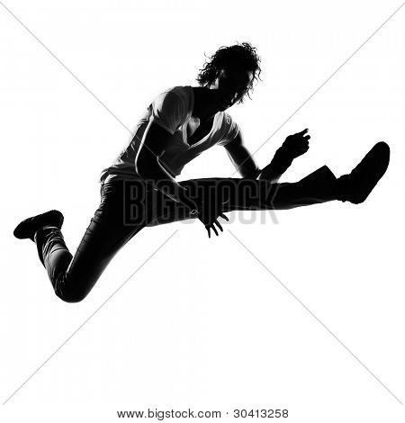 full length silhouet van een jonge man danser dansen funky hip hop r&b op geïsoleerde studio witte ba
