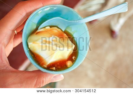 Buffalo Curd With Treacle In Cup. Street Food Is Different Per Country. One Great Street Food From S