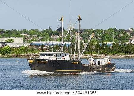 New Bedford, Massachusetts, Usa - May 31, 2019: Commercial Fishing Vessel Reflection Going Fishing
