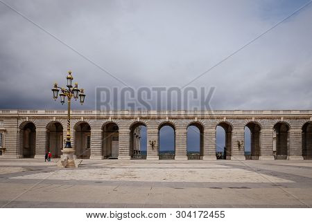 Neo-classical Style Of Arches At The Square Of Plaza De La Armeria In Rainy Day. Madrid, Spain.