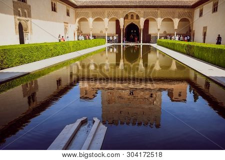 Granada, Spain. May 3, 2017 : Reflection In The Pond Water Of The Patio De Los Arrayanes Building (c