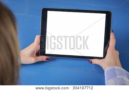 Mockup Image: Over Shoulder View Of Woman Looking At Modern Digital Tablet Computer Device With Whit