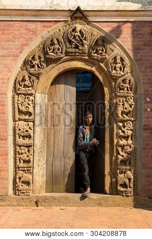 Kathmandu,nepal -october 16,2018 : Unidentified Nepalese Boy Walk Out From Door In Patan Duba Square