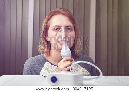 Woman Is Using Compressor Nebuliser System, Which Helps Patients With Interstitial Lung Disease.