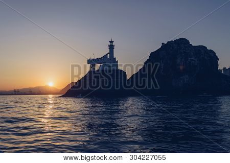 View From Seaside On Oryukdo Lighthouse At Sunset In Busan