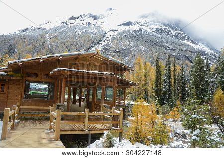 Wood House Or Rest Area For The Traveler With Snow Mountain At The Siguniang Scenic Area During Octo