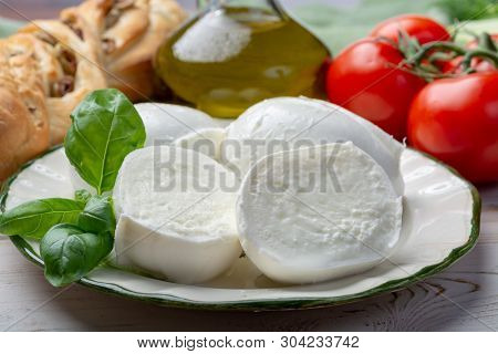 Balls And Pieces Of Buffalo Mozzarella, Soft Italian Scheese Made From The Milk Of Italian Mediterra