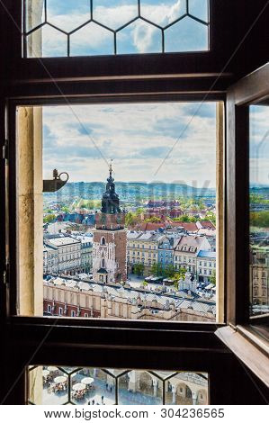 Krakow Poland. April 2019. An Elevated View Through St Marys Basillica Window Over The Medieval Old 