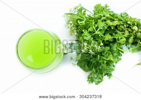 Fresh Parsley Juice  Or Coriander Juice In A Transparent Glass Isolated On White With Fresh Parsley