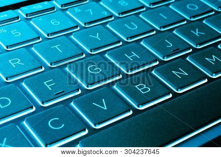 Closeup Of A Modern Silver Laptop Computer Keyboard. Laptop Keyboard. Detail Of The New And Ergonomi