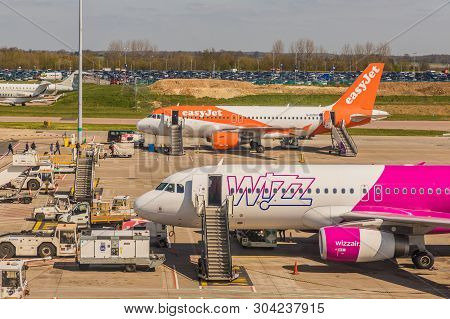 London Luton, England. Pril 2019. A View Of An Easyjet And Wizz Air Plane At Luton Airport In The Uk