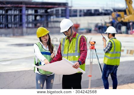 Surveyor Engineer With Theodolite At Construction Site During Surveying Work.engineer And Architect 