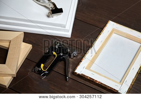 Canvas Stretching On Wood Stretcher Bar. Photo Printed On Canvas (back View),  Hammer, Steel Ruler A