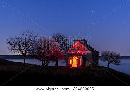 Deserted Church And Blooming Trees Nightscape, Romania, Europe