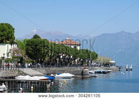 Few Ships Docked Neat Shore At Como Lake, Italy, Europe.