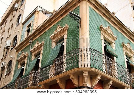 Old Colorful And Majestic Tiled Facades With Vintage Streetlight In Elche, Alicante, Spain. El Raval