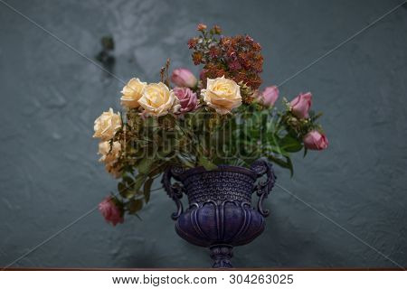 Beautiful And Stylish Artificial Flowers On A Blue Background
