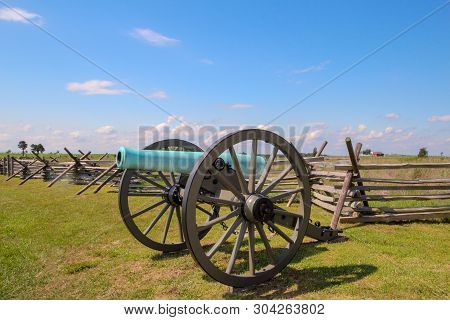 A Cannon Once Used In The American Civil War Sits Silently On A Field In Gettysburg, Pennsylvania.