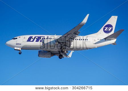 Moscow, Russia - March 26, 2019: Aircraft Boeing 737-500 Vp-bfs Of Utair Aviation Against Blue Sky I