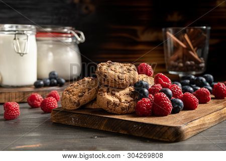 Homemade Chocolate Biscuits And Edible Berries Over Platter