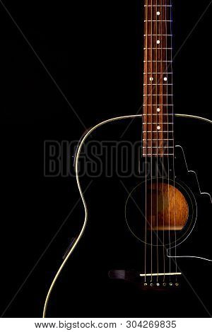 Musical Instrument Wood Acoustic Six-string Guitar Isolated On Blackbackground