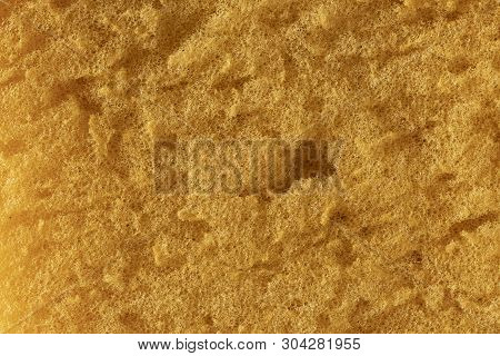 Macro Image Of The Orange Texture Of A Large Cleaning Sponge