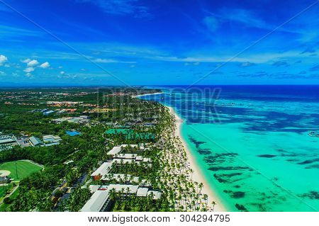 Aerial View Of Punta Cana Beach Resort, Dominican Republic. Summer Holiday With Parasailing, Diving,