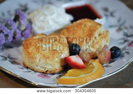 Scone Or Scone With Fruit ,whipping Cream And Sauce