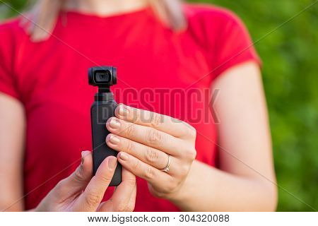 Close Up Picture Of Osmo Camera In Female Hands