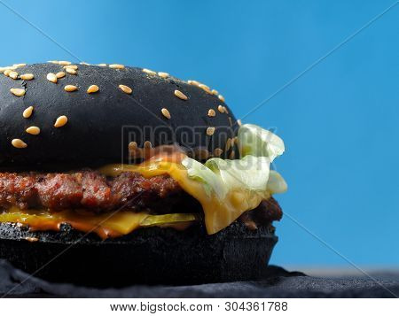 Black Hamburger, Beef Cutlet, Pickled Gherkins, Lettuce Leaves, Cheddar Double Cheese And Jalapeno P