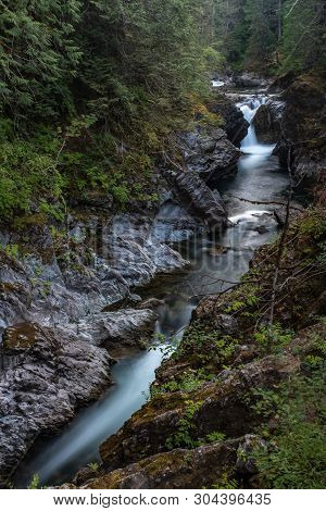 A Portrait Aspect Of Qualicum River Rushes Through The Gorge In Little Qualicum Provincial Park, Van