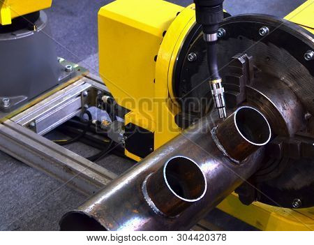 Industrial Automatic Robotic Welding Arm For Metal Welding Operations. Weld Seam Close-up. Shooting