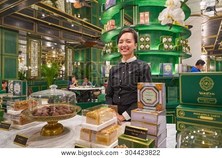 SINGAPORE - CIRCA APRIL, 2019: indoor portrait of staff in Violet Oon Singapore at Jewel Changi Airport.