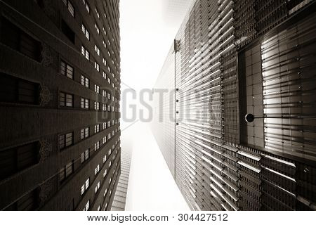 NEW YORK CITY - NOV 12: Downtown skyscrapers in a foggy day on November 12, 2014 in Manhattan, New York City. With population of 8.4M, it is the most populous city in the United States.