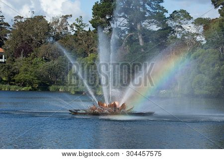 Rainbows In The Fountain Spray On The Lake